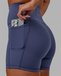 Woman wearing Fusion Ultra High-Rise 4" Short Pockets - Future Dusk | Model:Gabby | Size:S