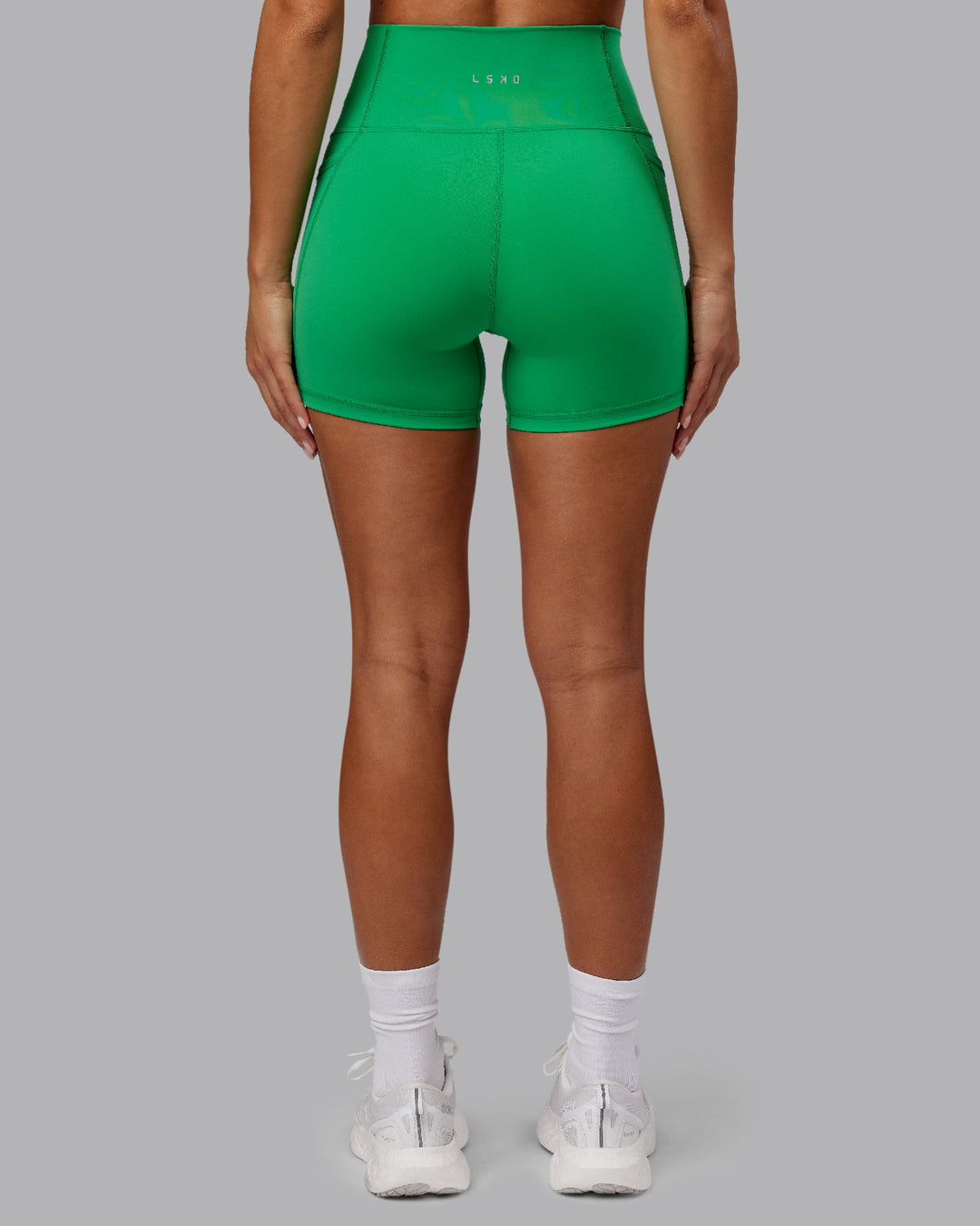 Woman wearing Fusion X-Length Shorts - Impact Green