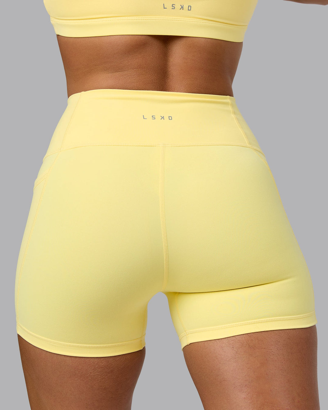 Woman wearing Fusion X-Short Tights with Pockets - Lemon