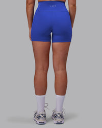 Woman wearing Fusion Ultra High-Rise 4" Short Pockets - Power Cobalt | Model:Hannah | Size:S