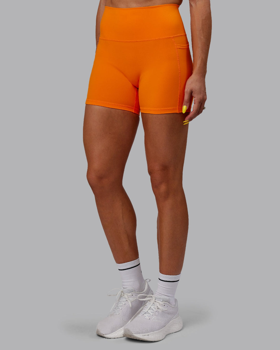 Woman wearing Fusion X-Length Shorts - Vibrant Orange