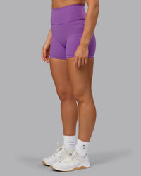Woman wearing Fusion Ultra High-Rise 4" Short Pockets - Purple Fizz | Model:Shalem | Size:S
