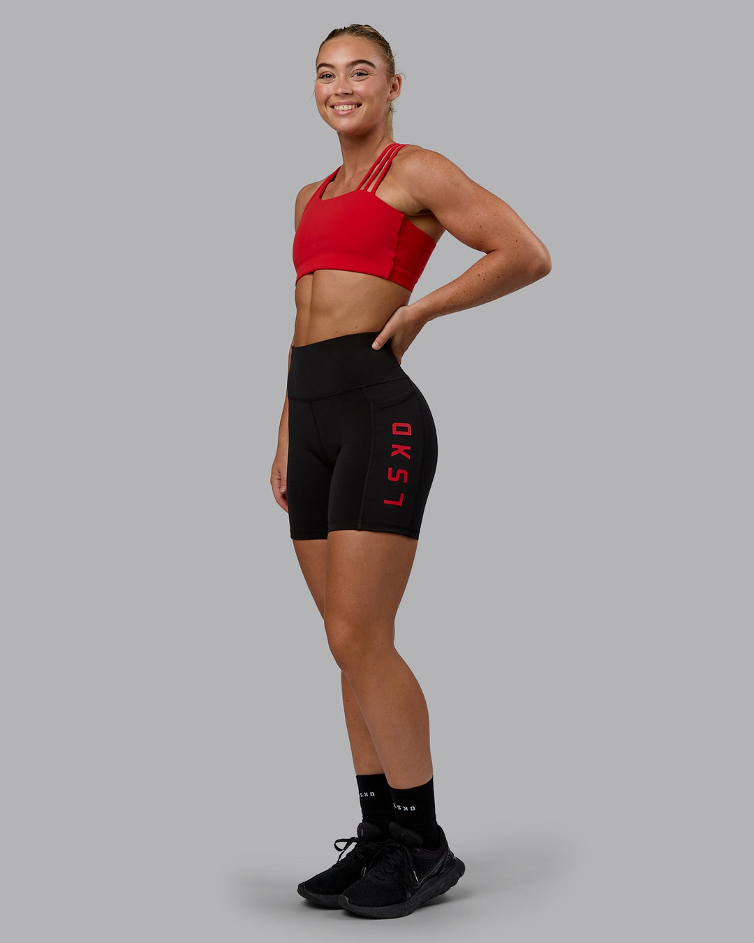 Woman wearing Galvanise Sports Bra - Crimson