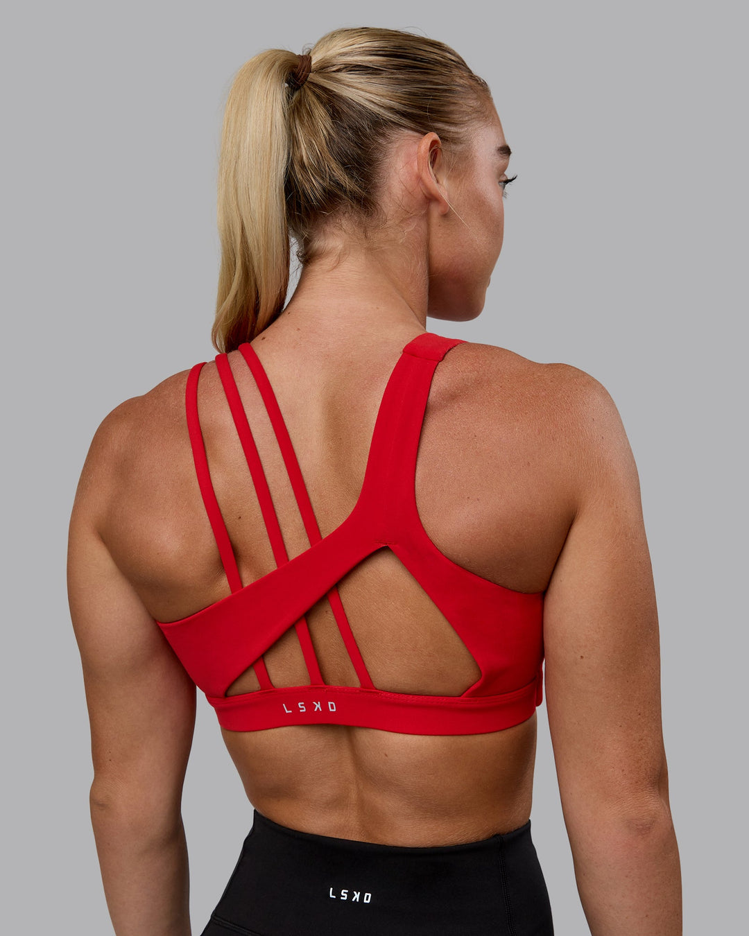 Woman wearing Galvanise Sports Bra - Crimson