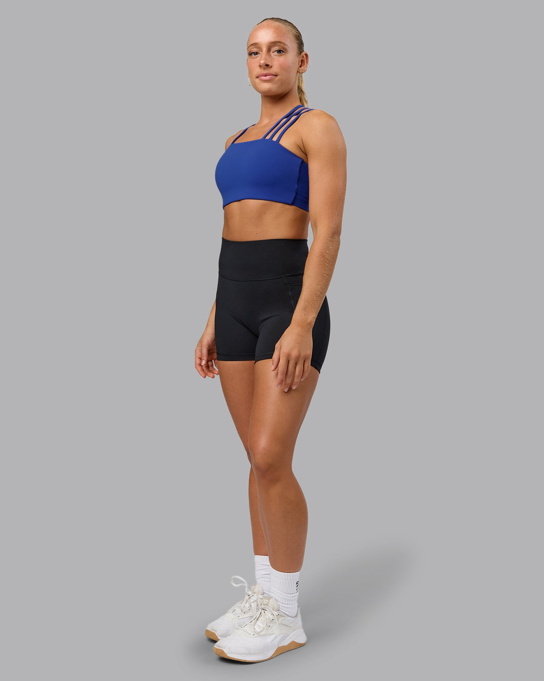 Woman wearing Galvanise Sports Bra - Power Cobalt