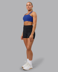 Woman wearing Galvanise Sports Bra - Power Cobalt