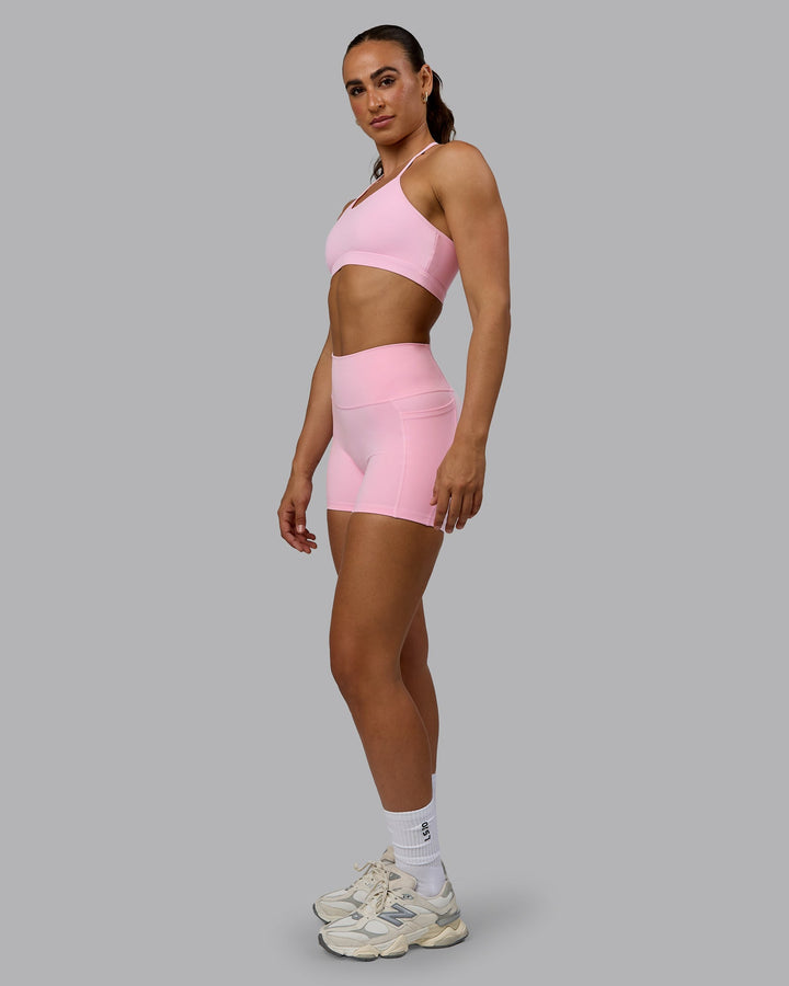 Woman wearing Glow Sports Bra - Pale Pink
