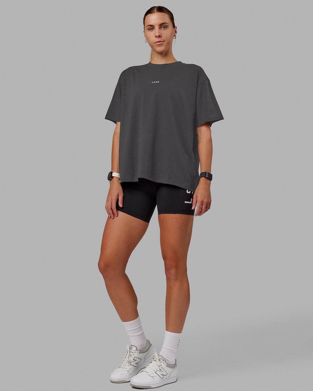 Woman wearing Go-To FLXCotton Oversized Tee - Dark Storm-White