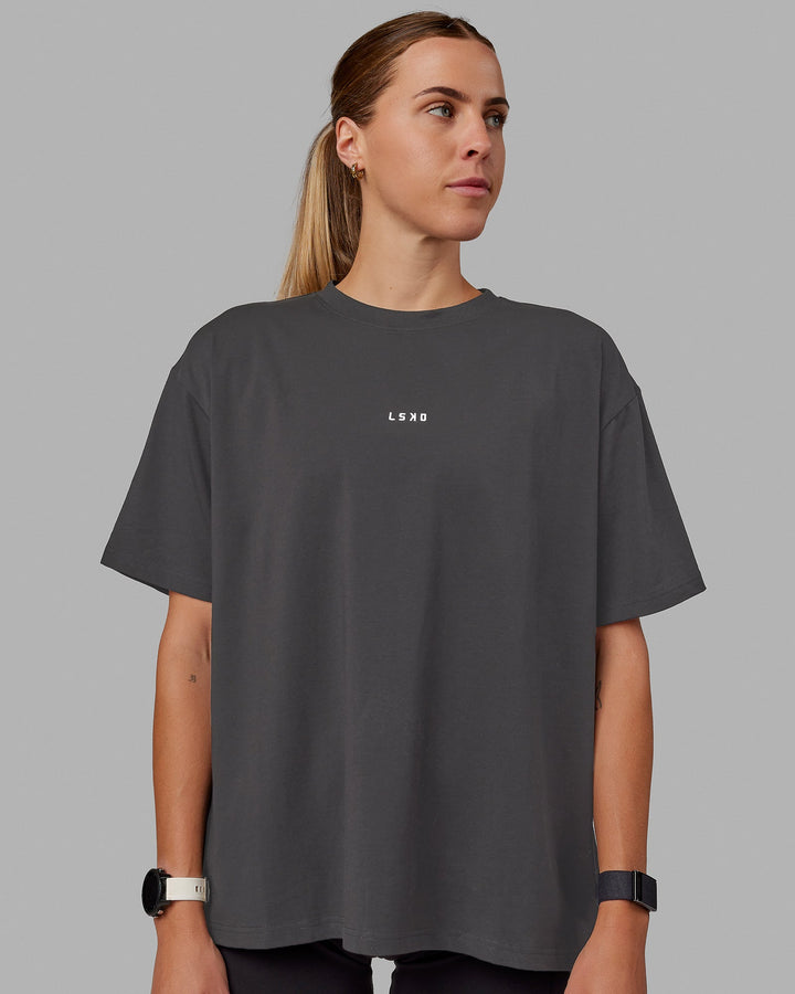 Woman wearing Go-To FLXCotton Oversized Tee - Dark Storm-White
