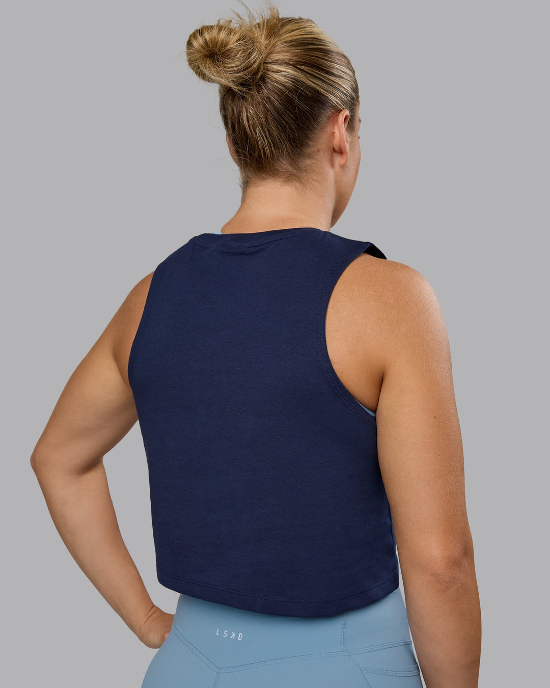 Woman wearing Go-To FLXCotton Tank - Future Navy-White