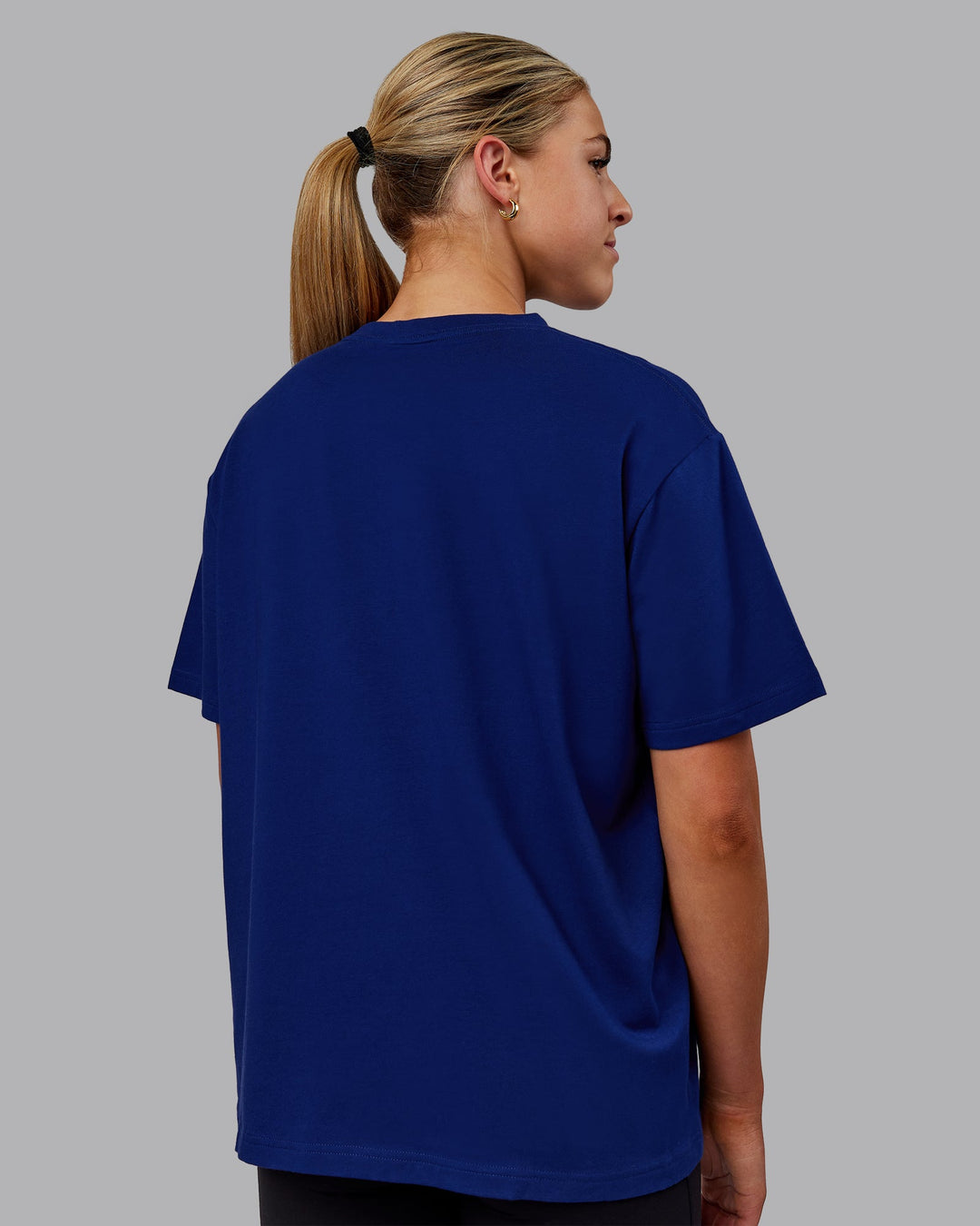 Woman wearing Go-To FLXCotton Oversized Tee - Midnight Blue