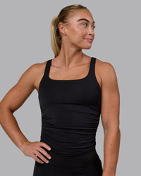 Woman wearing Ignite Scrunch Side Tank - Black