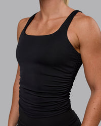 Woman wearing Ignite Scrunch Side Tank - Black
