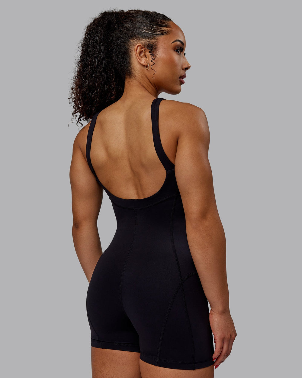 Woman wearing Inertia Bodysuit - Black