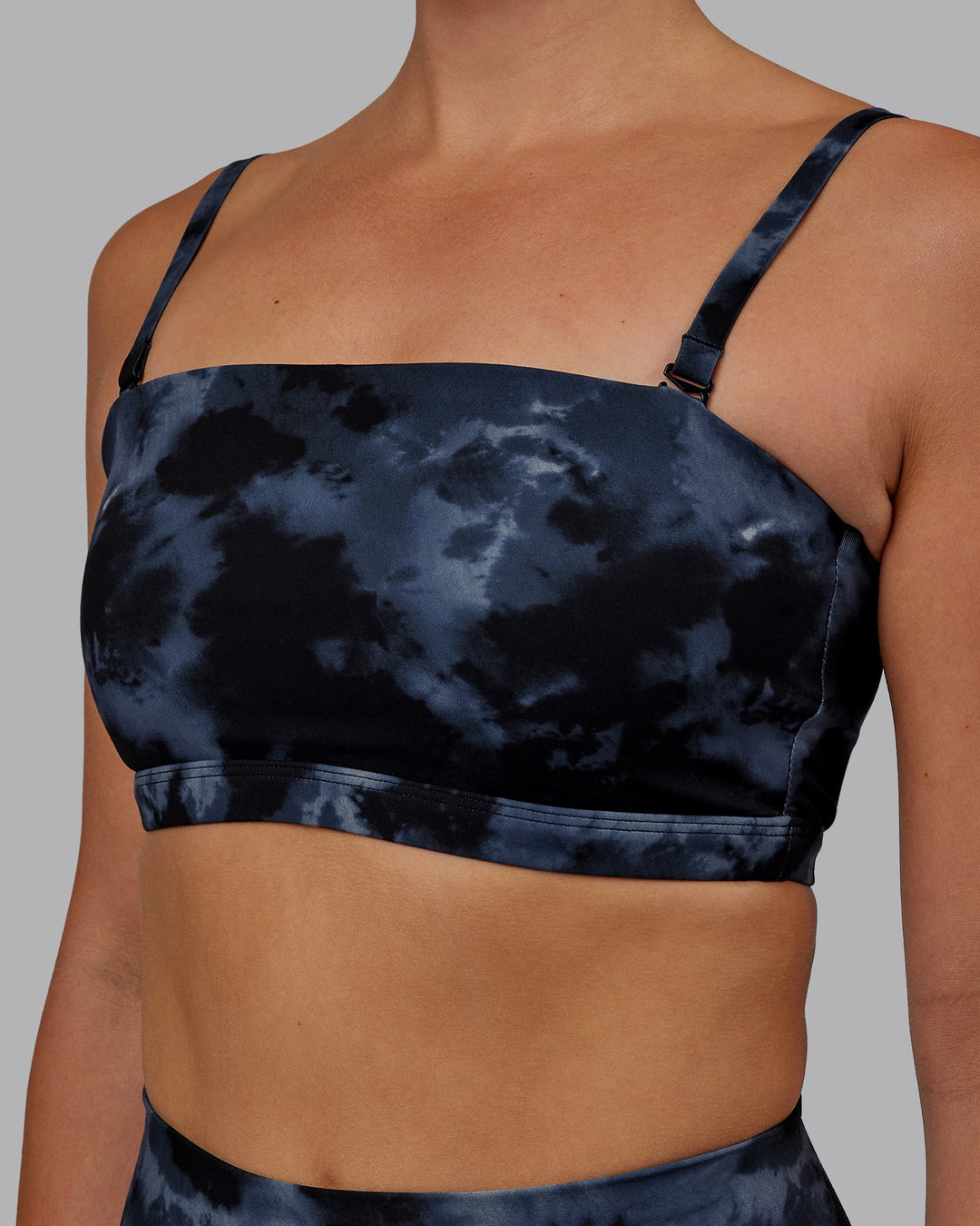 Woman wearing Inspire Sports Bra - Tie Dye-Midnight