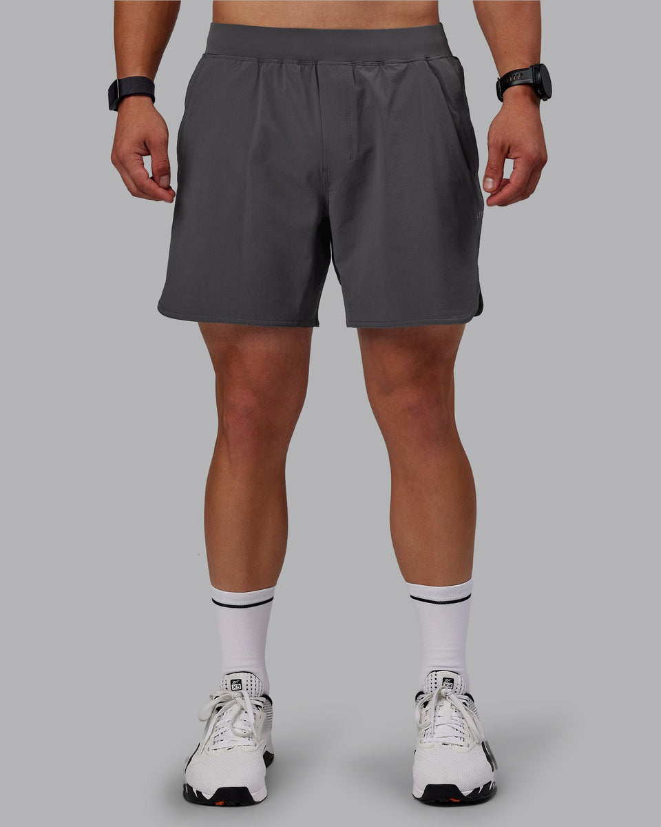 Man wearing Lift 6" Lined Performance Shorts - Dark Storm