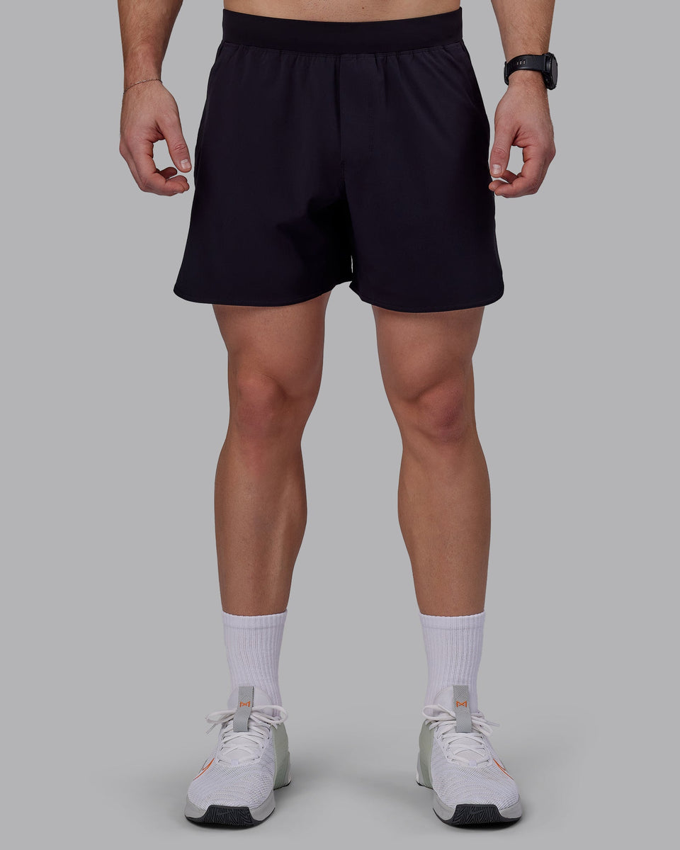 Man wearing Lift 6" Performance Shorts - Black-Reflective