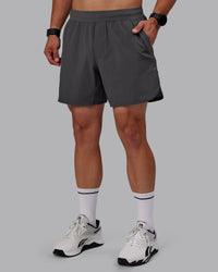 Man wearing Lift 6" Performance Shorts - Dark Storm