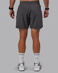 Man wearing Lift 6" Performance Shorts - Dark Storm