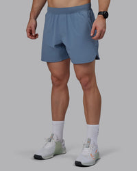 Man wearing Lift 6" Performance Shorts - Elemental Blue