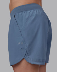 Man wearing Lift 6" Performance Shorts - Elemental Blue