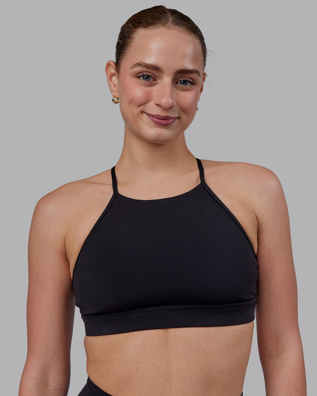 Woman wearing Lift High Neck Sports Bra - Black