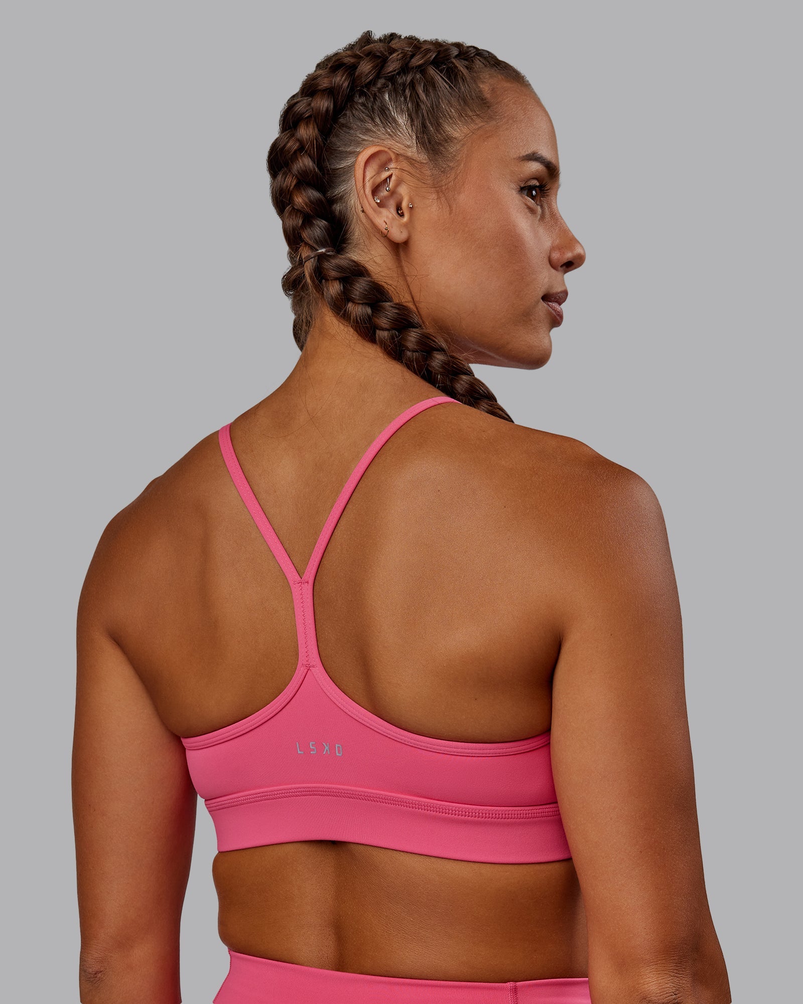 Woman wearing Lift High Neck Sports Bra - Hot Pink