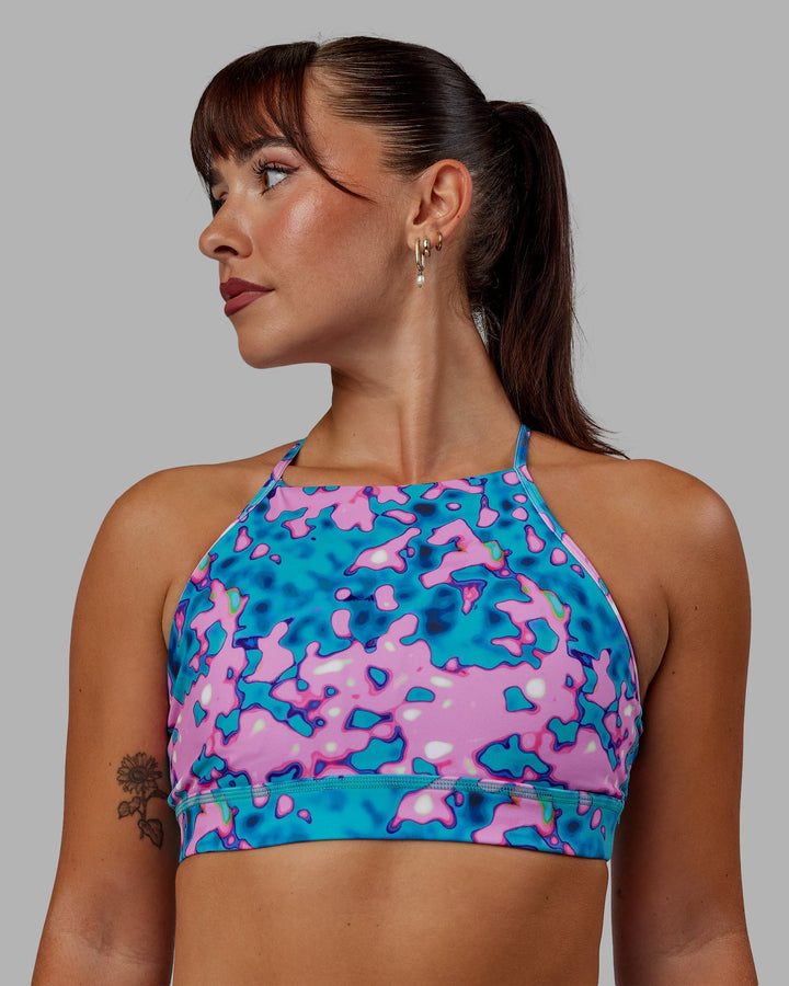 Woman wearing Lift High Neck Sports Bra - Neon Camo
