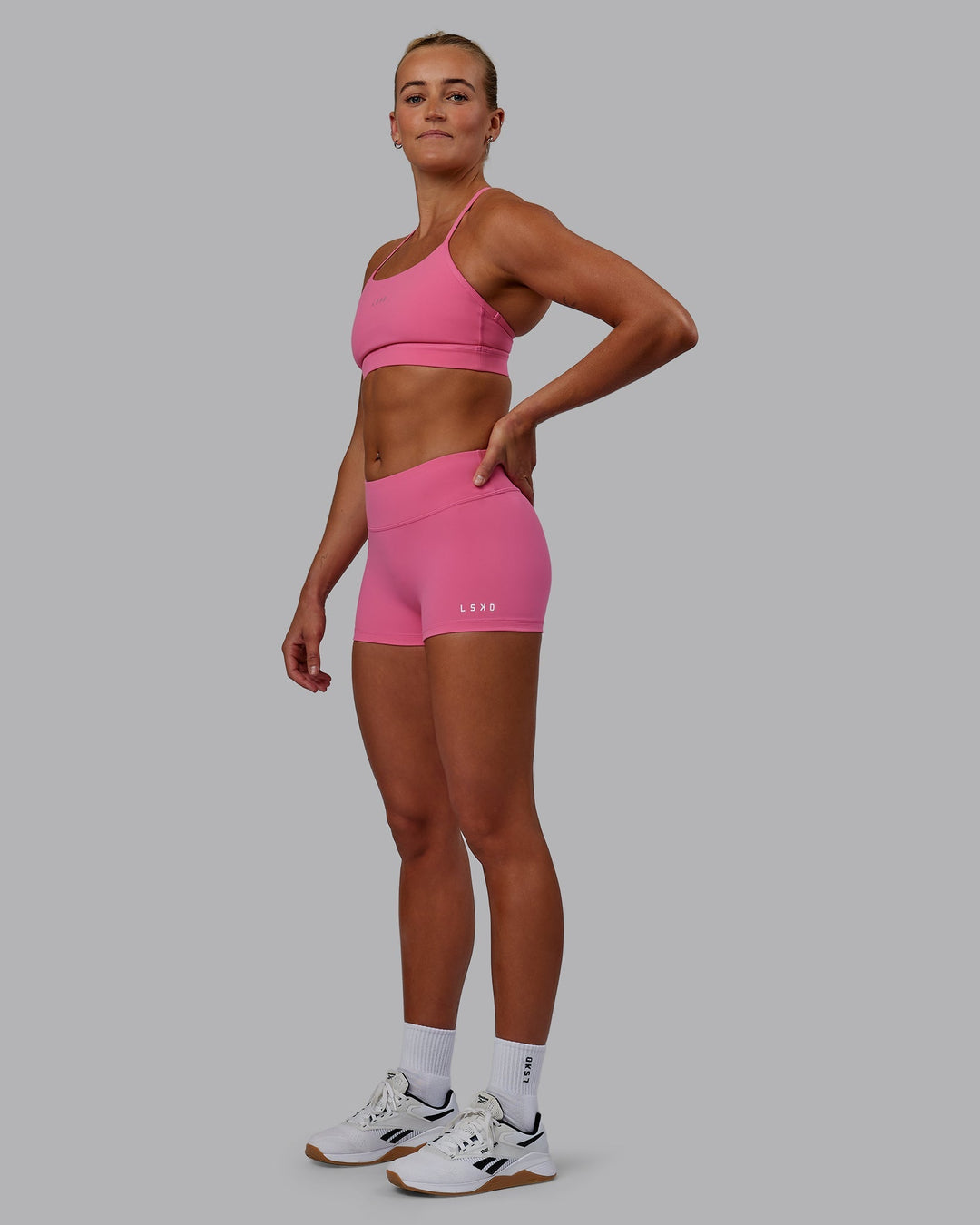 Woman wearing Lift Sports Bra - Carmine Rose