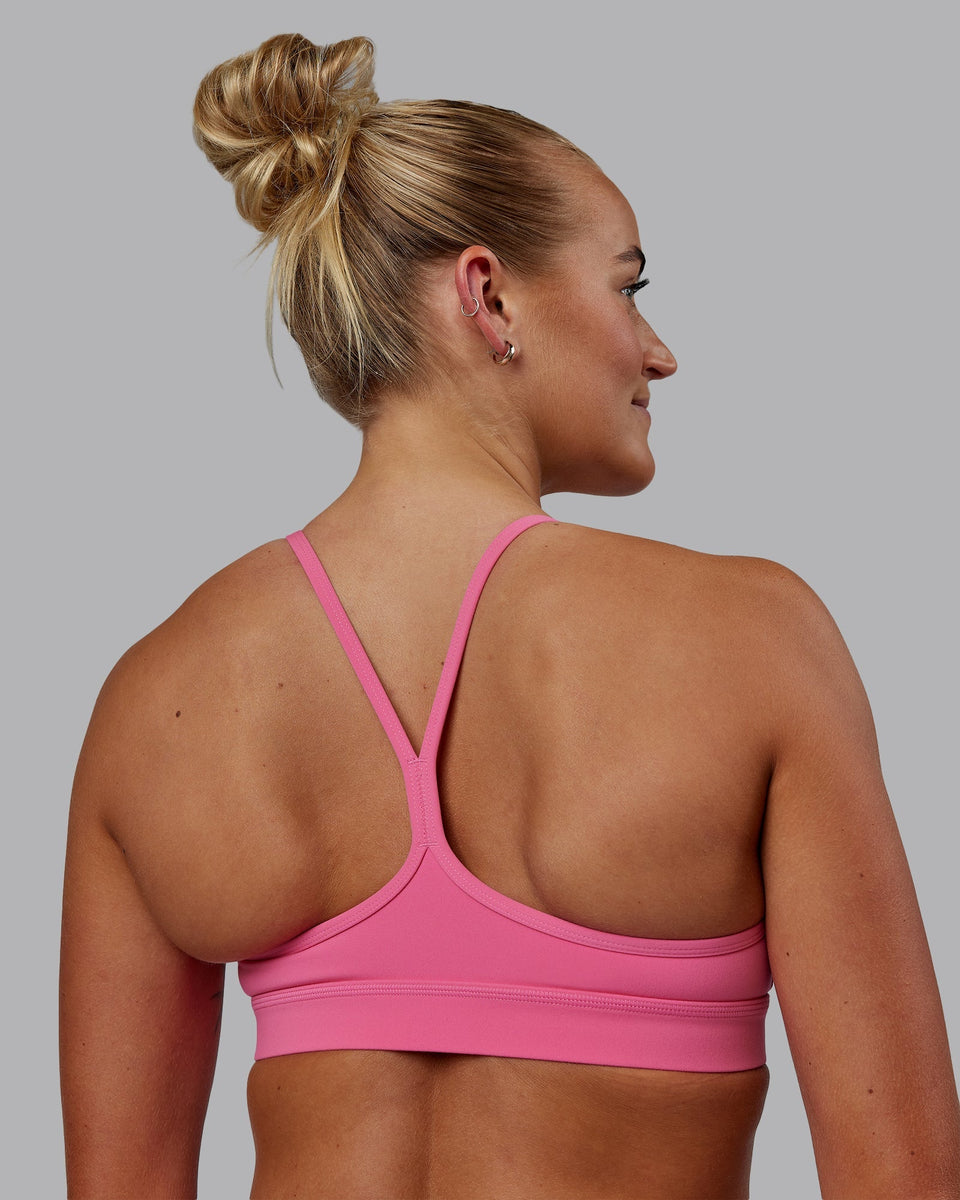 Woman wearing Lift Sports Bra - Carmine Rose