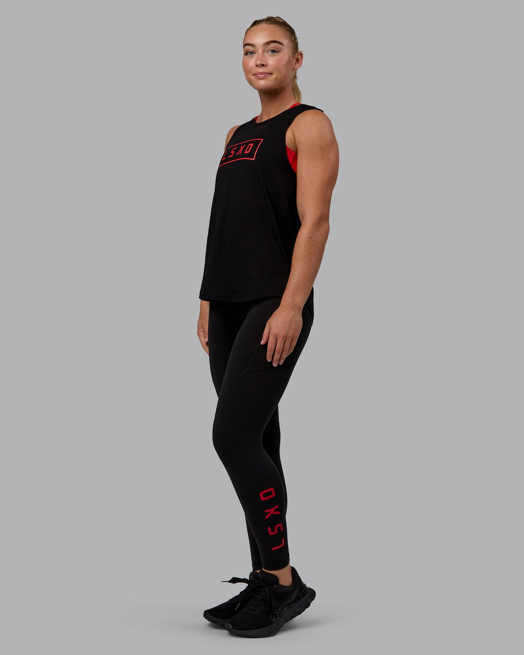 Woman wearing Luna FLXCotton Longline Tank - Black-Crimson