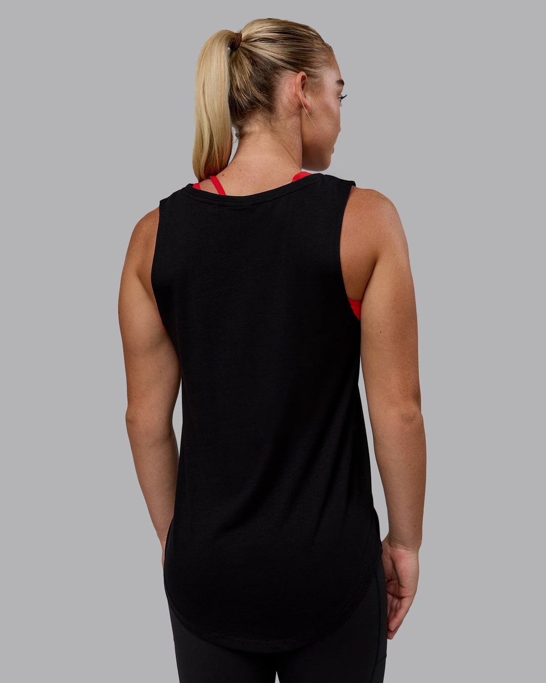 Woman wearing Luna FLXCotton Longline Tank - Black-Crimson