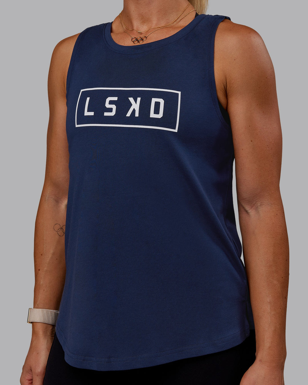 Woman wearing Luna FLXCotton Longline Tank - Future Navy-White