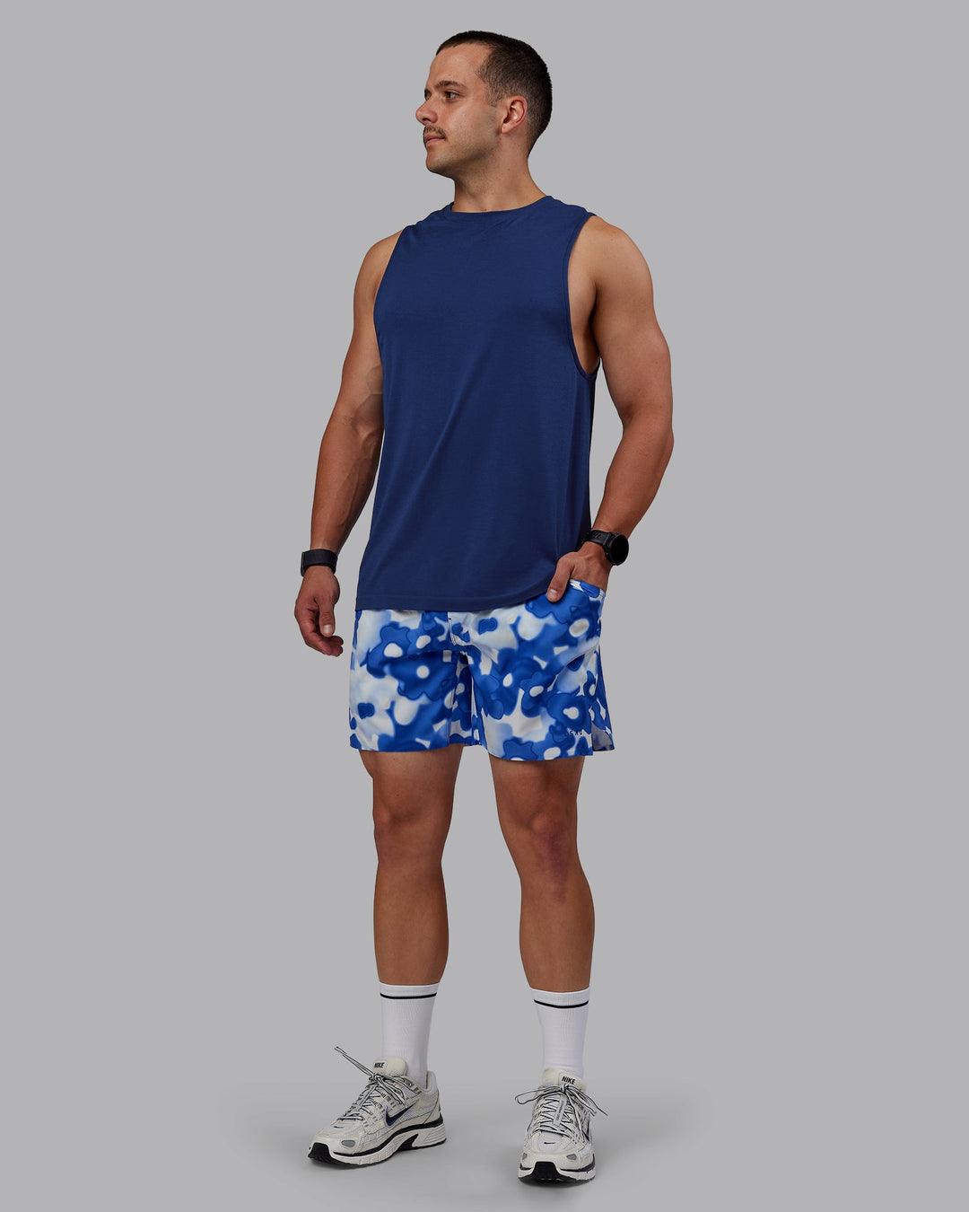 Man wearing AeroFLX+ Seamless Muscle Tank - Midnight Blue/Midnight Blue Marl