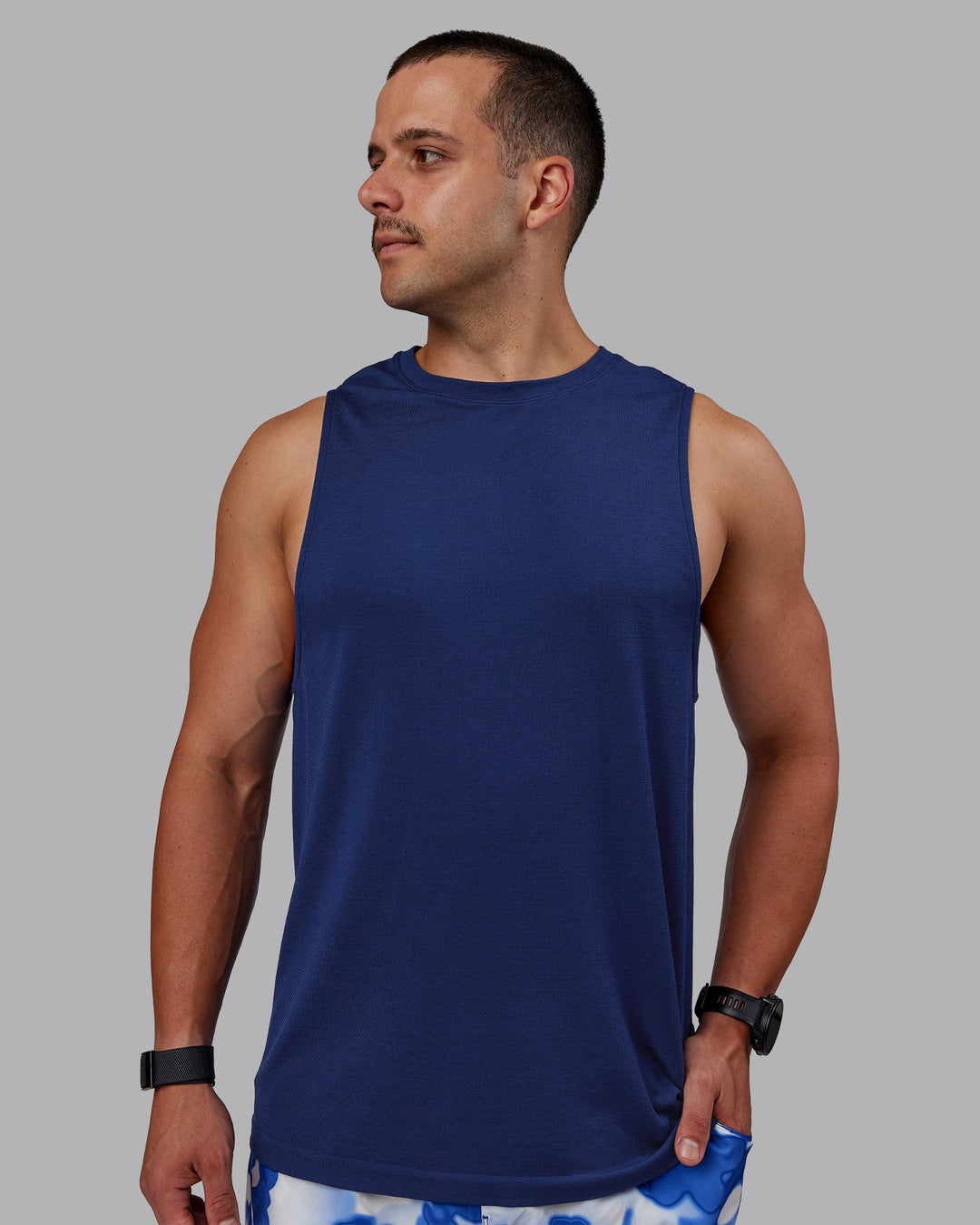 Man wearing AeroFLX+ Seamless Muscle Tank - Midnight Blue/Midnight Blue Marl