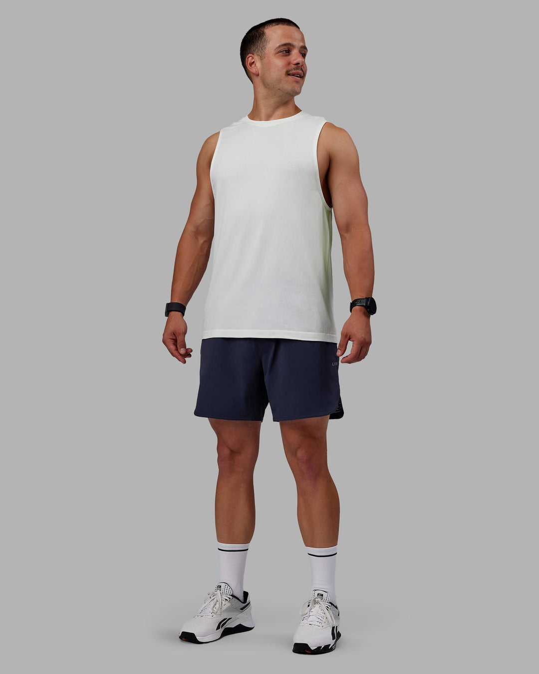 Man wearing AeroFLX+ Seamless Muscle Tank - Off White/Off White Marl