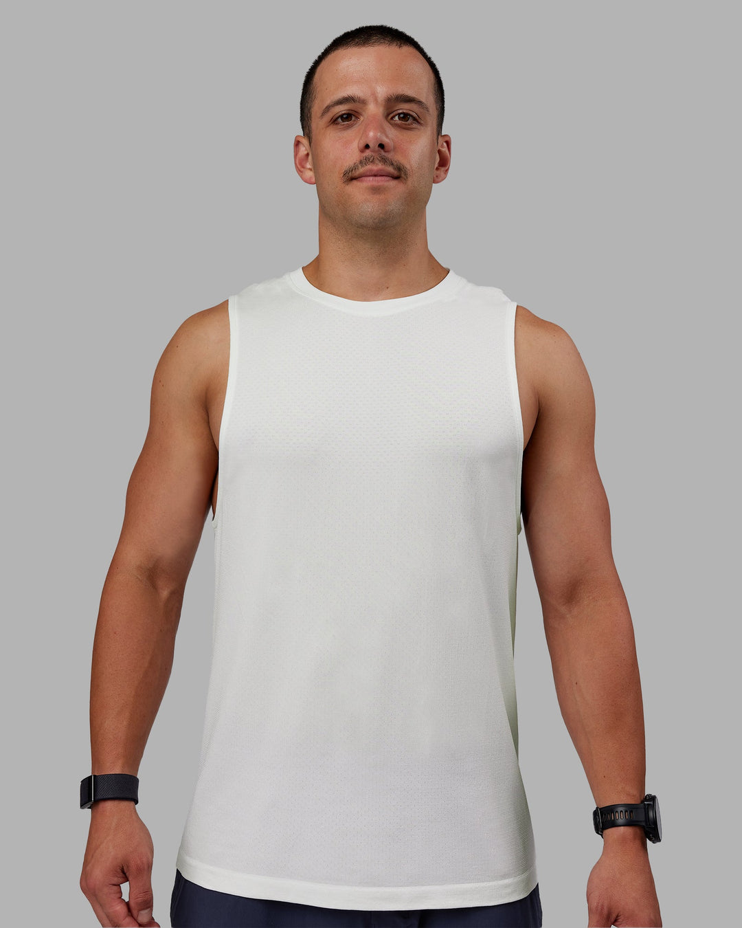 Man wearing AeroFLX+ Seamless Muscle Tank - Off White/Off White Marl