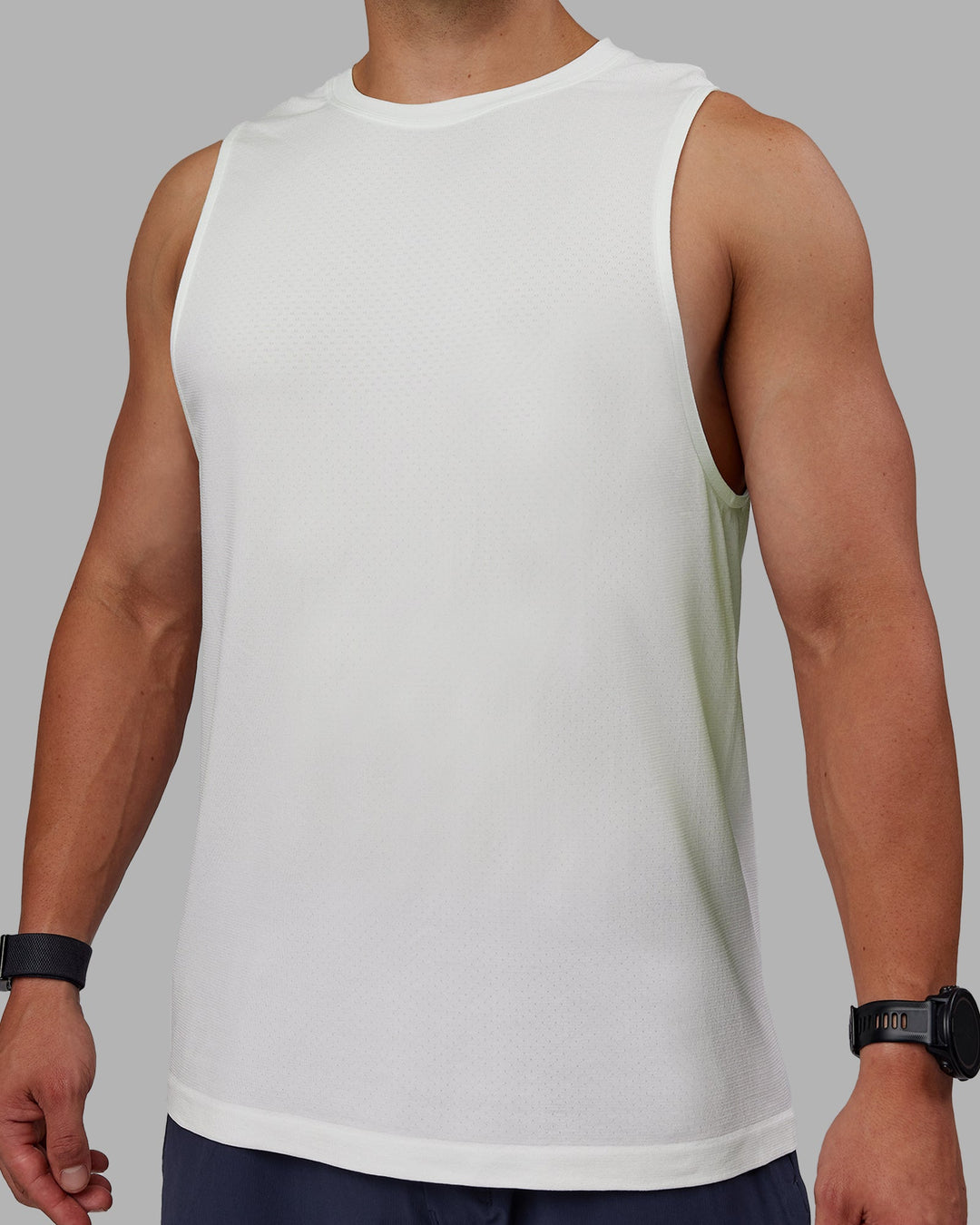 Man wearing AeroFLX+ Seamless Muscle Tank - Off White/Off White Marl