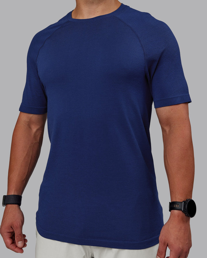 Man wearing AeroFLX+ Seamless Tee - Midnight Blue/Midnight Blue Marl
