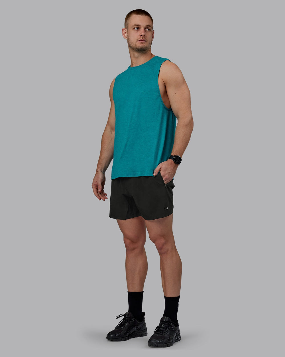 Man wearing AeroFLX+ Seamless Muscle Tank - Blue Bird Marl