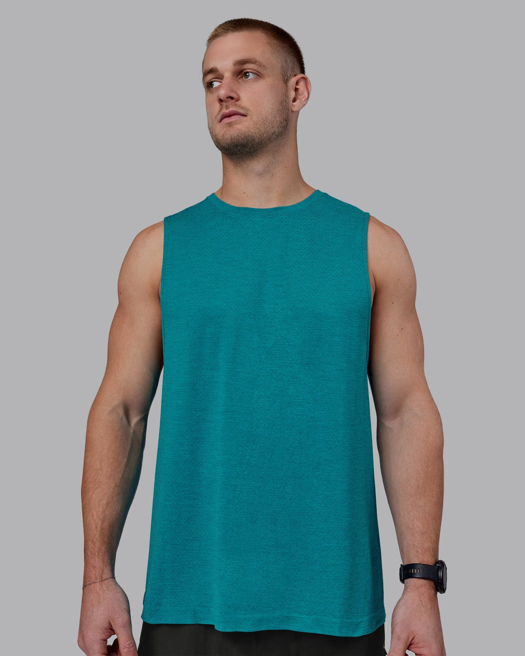 Man wearing AeroFLX+ Seamless Muscle Tank - Blue Bird Marl