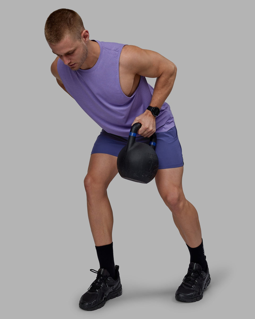 Man wearing AeroFLX+ Seamless Muscle Tank - Dahlia Purple Marl