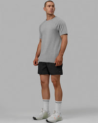 Man wearing AeroFLX+ Seamless Tee - Lt Grey Marl