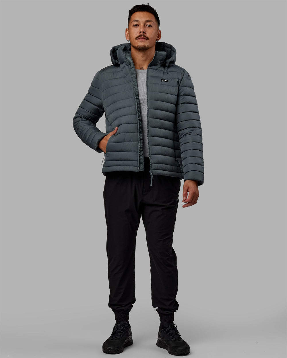 Man wearing All Day Puffer Jacket - Storm