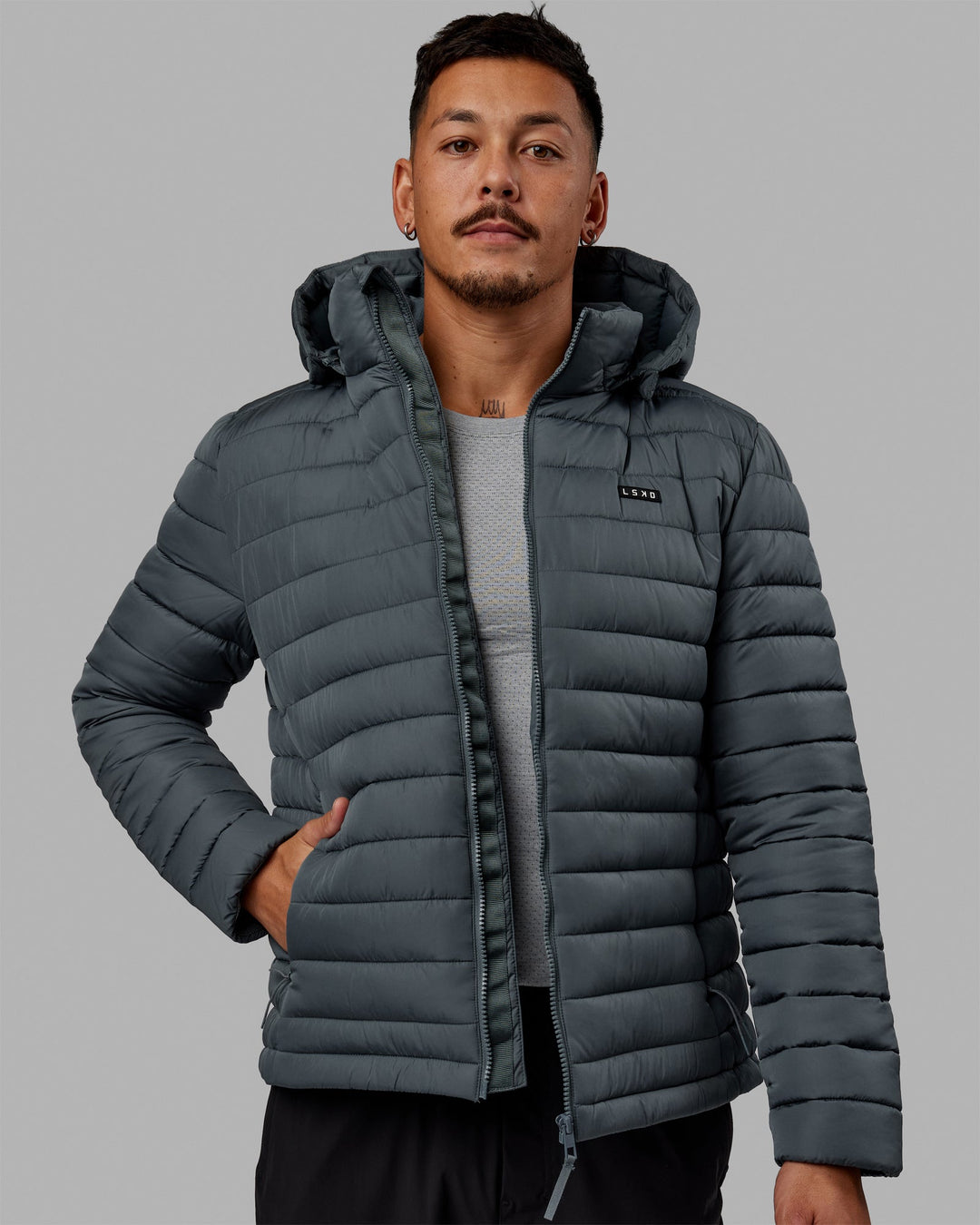 Man wearing All Day Puffer Jacket - Storm