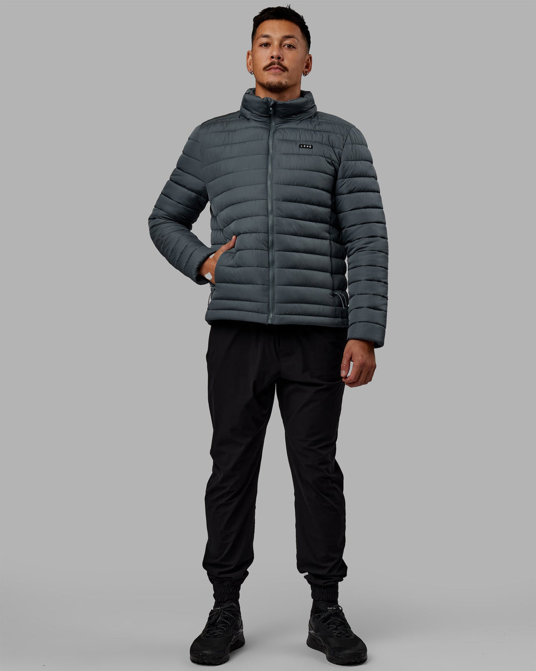 Man wearing All Day Puffer Jacket - Storm