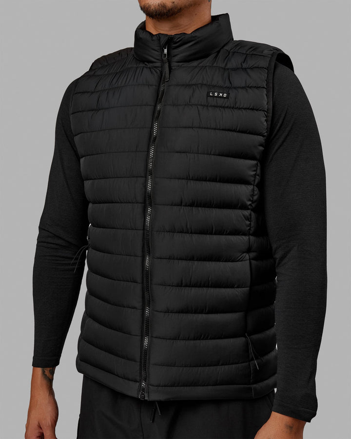 Man wearing All Day Puffer Vest - Black
