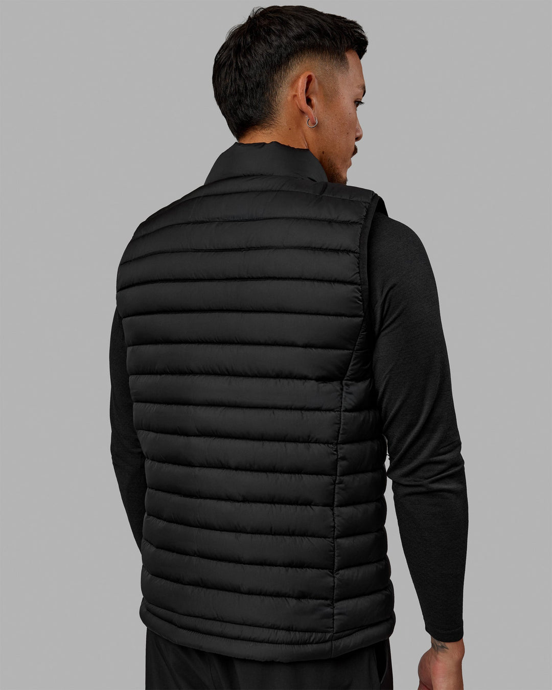 Man wearing All Day Puffer Vest - Black