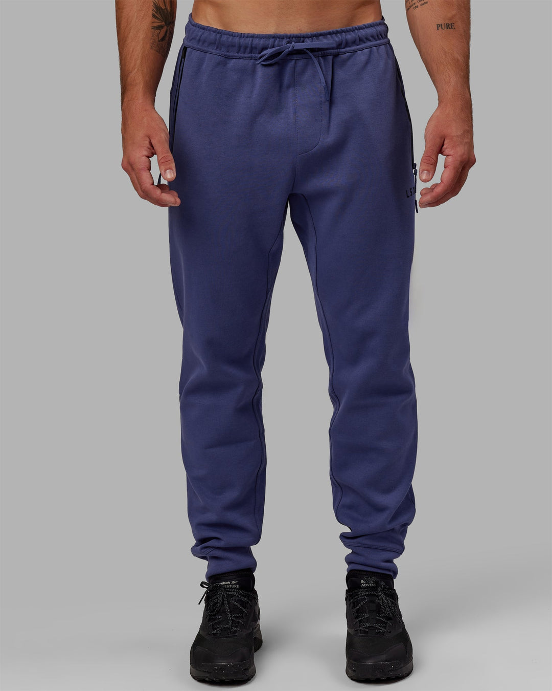 Man wearing Athlete ForgedFleece Zip Jogger - Future Dusk