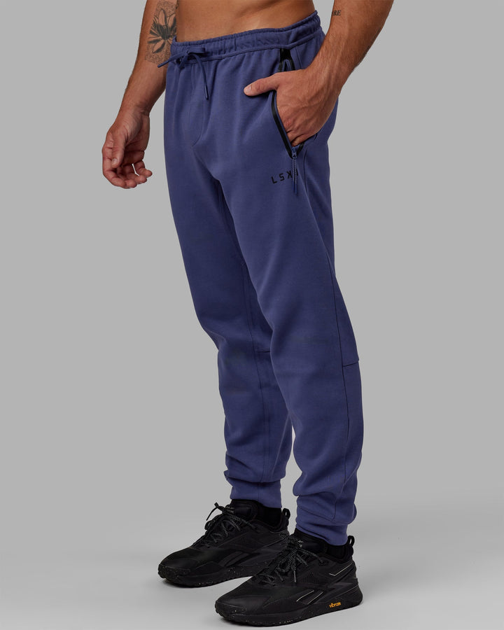 Man wearing Athlete ForgedFleece Zip Jogger - Future Dusk
